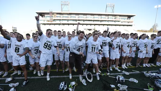 Men's Lacrosse team celebrates after singing second against Navy, April 11, 2026.
