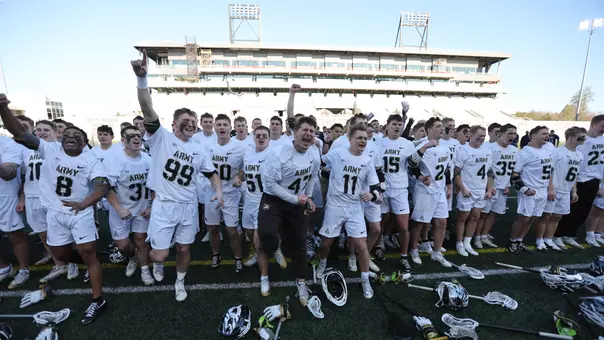 Men's Lacrosse team celebrates after singing second against Navy, April 11, 2026.