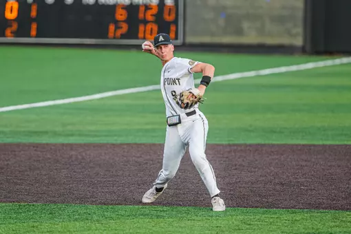 Mason Scott fields a ground ball at third base and gets set for the throw across the diamond.