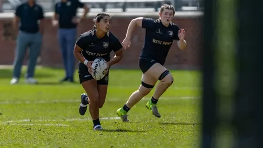 Yesenia Morales of women's rugby runs with the ball towards the end zone