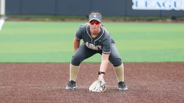 Ashton White Watches an Iona Batter in Doubleheader Action