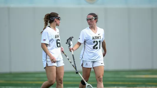 Brigid Duffy and Ryan Remaly walk together against Holy Cross 4.15.26