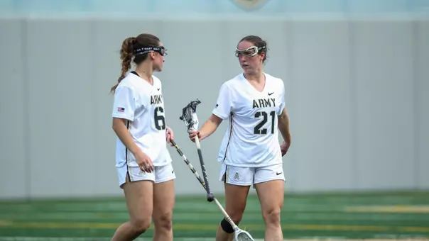 Brigid Duffy and Ryan Remaly walk together against Holy Cross 4.15.26