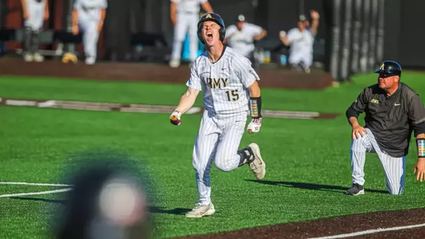 Chris Barr celebrates a triple turned run on an E6