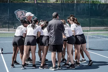 Army Women's Tennis huddles before its postseason match.