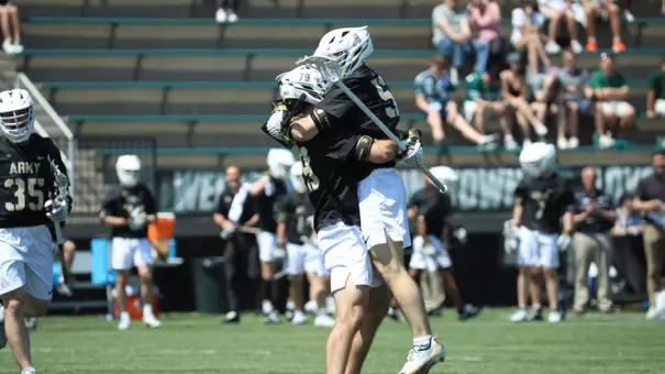 Sam Ralston and CJ Monturio hugging after a goal at Loyola Maryland on April 18, 2026.