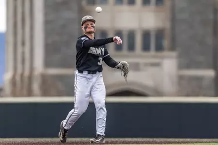 Thomas Schreck throws the ball back to the pitcher.