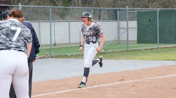 Hannah Laub Celebrates Hitting a Home Run with Her Teammates