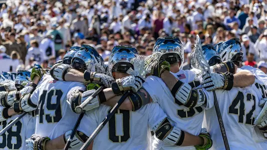 Men's Lacrosse team huddles up before Army-Navy game.