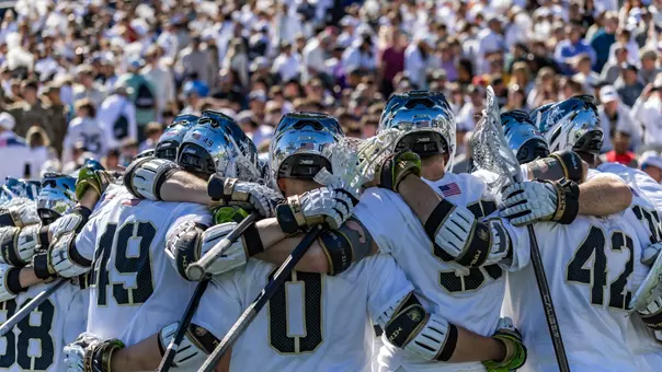 Men's Lacrosse team huddles up before Army-Navy game.