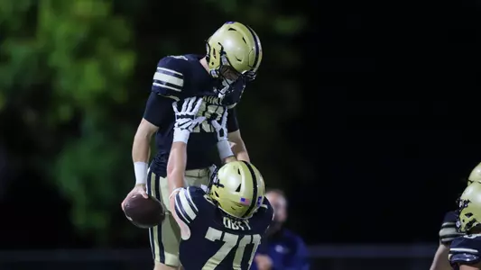 Kyle West celebrates a touchdown with his teammate Luke Melton on Oct. 3, 2025