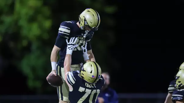 Kyle West celebrates a touchdown with his teammate Luke Melton on Oct. 3, 2025