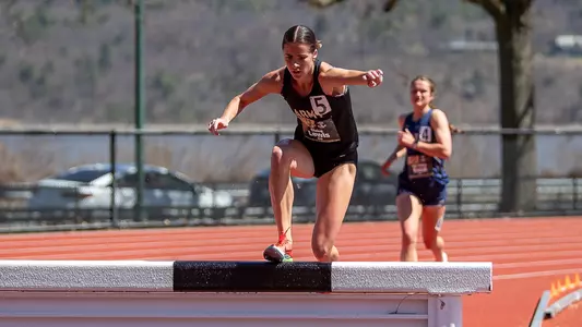 Claire Lewis competes in the 3000m steeplechase at the Army-Navy Meet