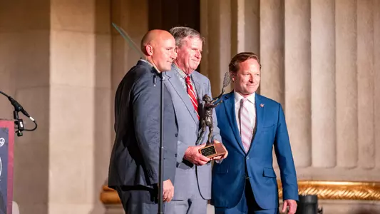 Jack Emmer and Joe Alberici stand on stage after Emer received the 2026 Spirit of Tewaaraton Award.