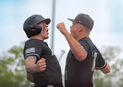 Sean Newton and Josiah Overbeek celebrate in Army Baseball's win at Navy.