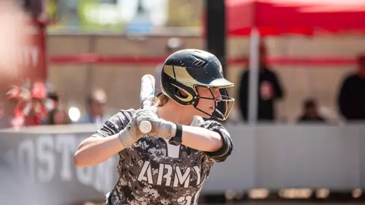 Army softball player stands ready at the plate against Boston University.