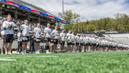 Men's Lacrosse lines up for the national anthem against Loyola Maryland