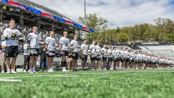 Men's Lacrosse lines up for the national anthem against Loyola Maryland