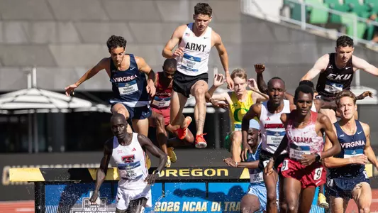 Nathan Davis vaulting over a water barrier in the 3000m steeplechase at the 2026 NCAA DI Outdoor Track & Field Championships.