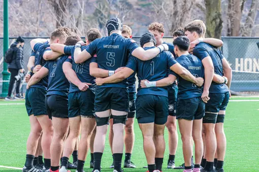 The Army Men's Rugby team huddles before a match.