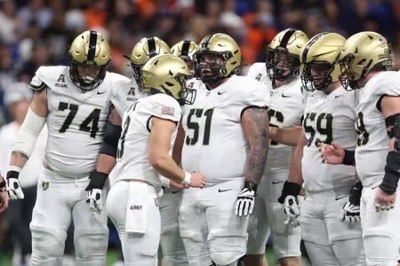 The Army Offensive Line huddles before at play at UTSA in 2025.