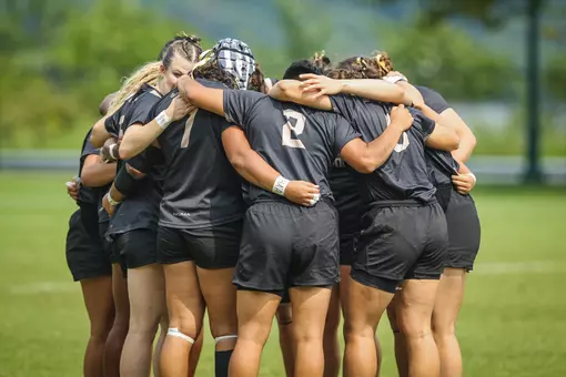 The Army women's rugby team huddles before a match at Anderson Rugby Complex.