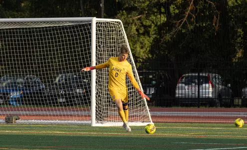 Army Goalkeeper Collin Gilbert kicks soccer ball