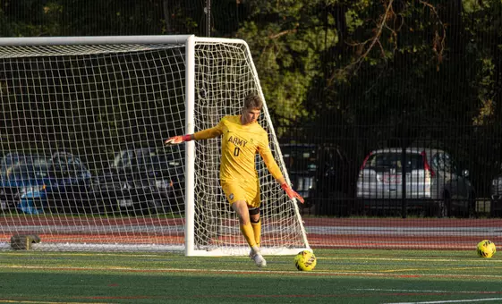 Army Goalkeeper Collin Gilbert kicks soccer ball