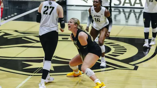 Audrey St. Clair Cheers after Teammate Earns Kills Against Marist inside Gillis Field House