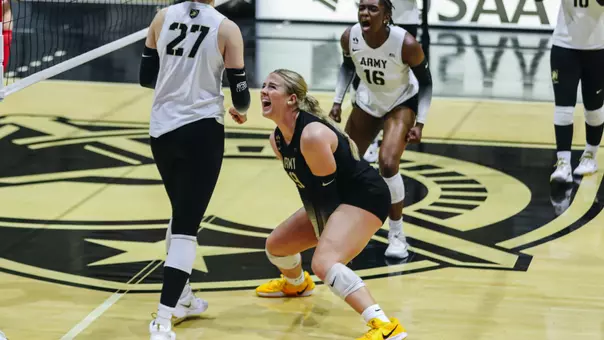 Audrey St. Clair Cheers after Teammate Earns Kills Against Marist inside Gillis Field House