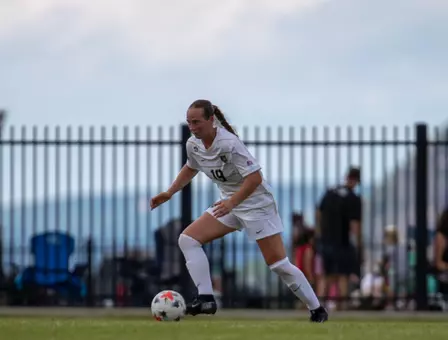 Army women's soccer sophomore, Ailyn Rowe, dribbles the ball downfield in game play