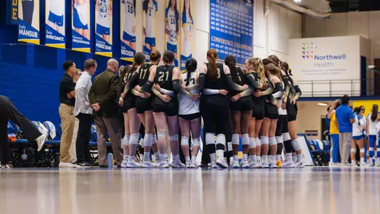 Volleyball Huddles Together During a Timeout at the Hofstra Invitational