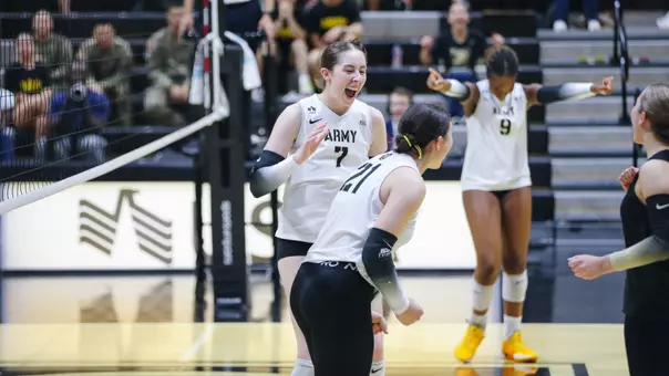 Michelle Parker Cheers with Marlee Lightsey After Kill Against Loyola Maryland