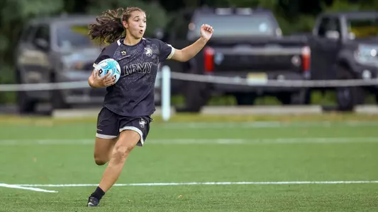 An Army women's rugby player runs with the ball in a match against La Salle on Sept. 11, 2026