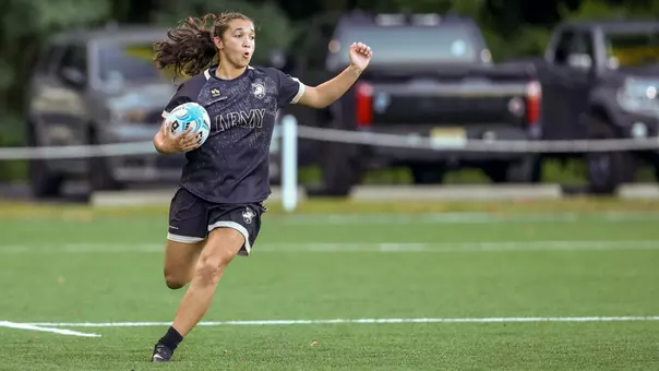 An Army women's rugby player runs with the ball in a match against La Salle on Sept. 11, 2026