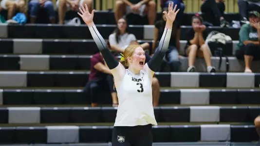 Juliette Myrick Celebrates a Point Scored Against Loyola Maryland