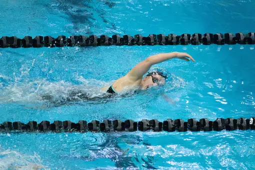 Army women's swimmer swims in water during Thursday Night Showdown Meet
