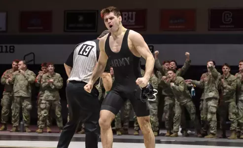 Gunner Filipowicz celebrates a pin in a 2025-26 match vs. Bucknell.