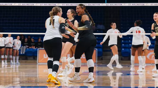 Hannah Hankerson Smiles with Nicole Stroud After Army Scores a Point Against Sam Houston State