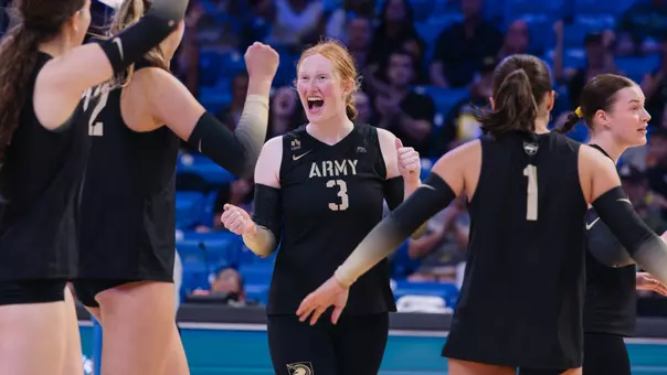 Juliette Myrick Celebrates Point Against UTA with Teammates