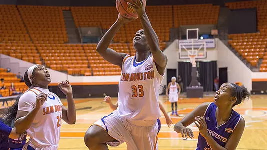 Demons pull away for 66-57 win over Kats