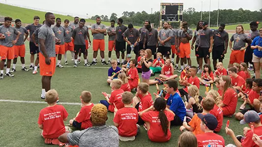 Football Team Holds Clinic for YMCA Kids