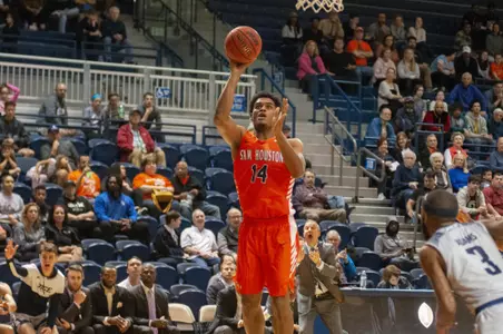 Kai Mitchell shots a floater at Rice.