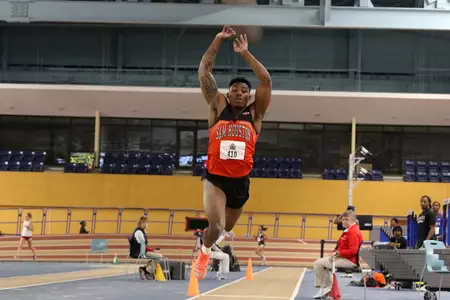 Zach Johnson competes in the long jump.