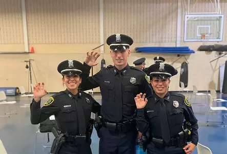 Former track stars graduate police academy