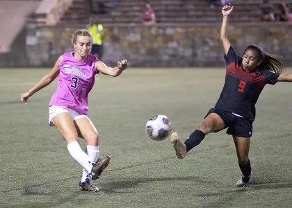 April Bennett kicks the ball against Lamar