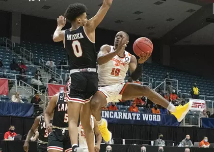 Zach Nutall goes up against Lamar at the SLC tournament