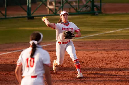 Kyndal Kutac throws to first