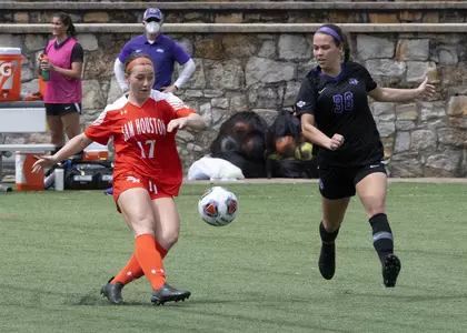 Grace Stine plays the ball against ACU