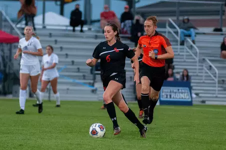 Courtney Pawlik dribbles against ACU